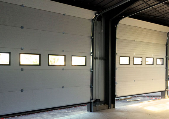 Portes sectionnelles pour atelier lavage